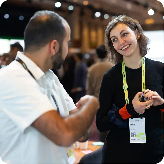 Zendesk Relate attendees have a conversation in the expo hall
